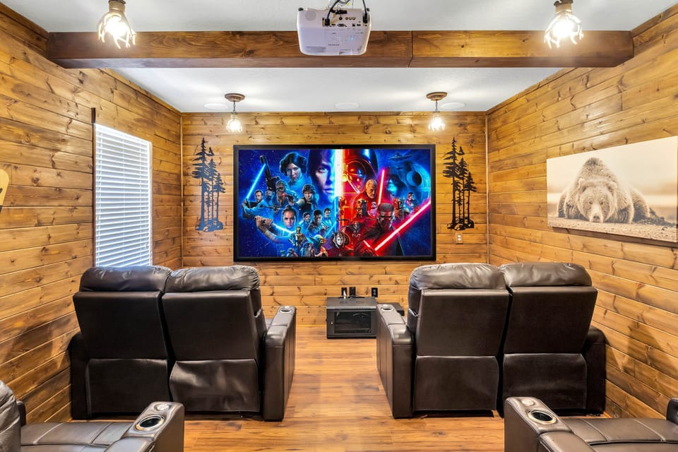 - Private cinema room with Star Wars wall art  
- Recliner chairs and big screen entertainment  
- Vacation rental with theater near Disney