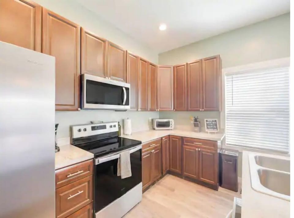 Spacious kitchen with all the appliances and cooking utensils that you need
