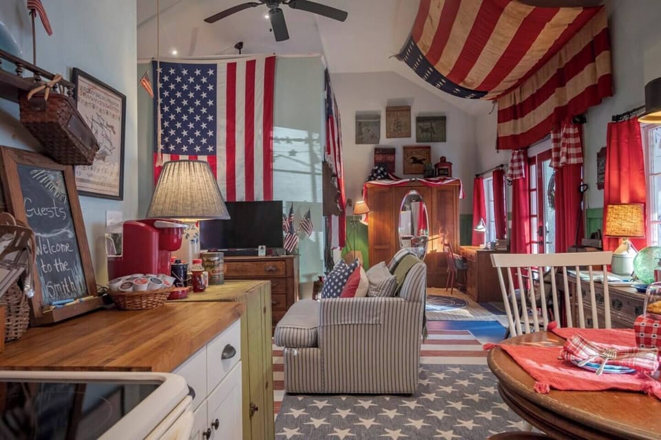 This angle shows the kitchen to the living room.
The large flag on the partition wall separates the living room from the king bedroom area. 