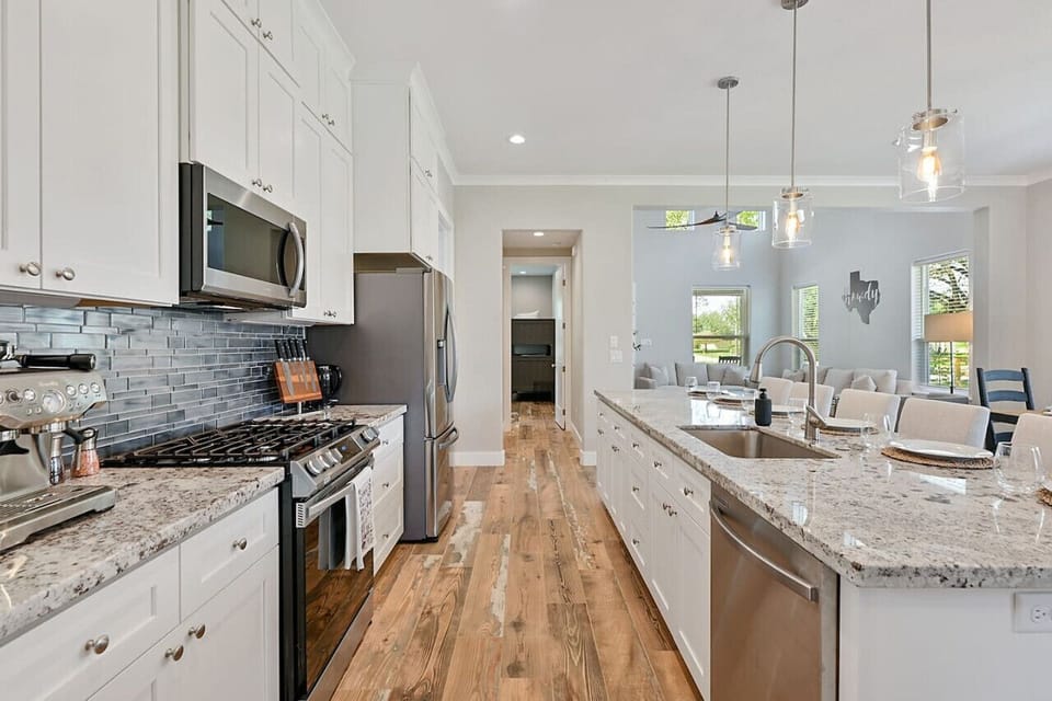 Kitchen equipped with a sleek espresso machine for coffee enthusiasts.