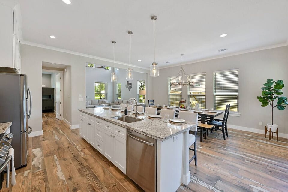 Abundant counter space enhances functionality in the beautifully designed kitchen.
