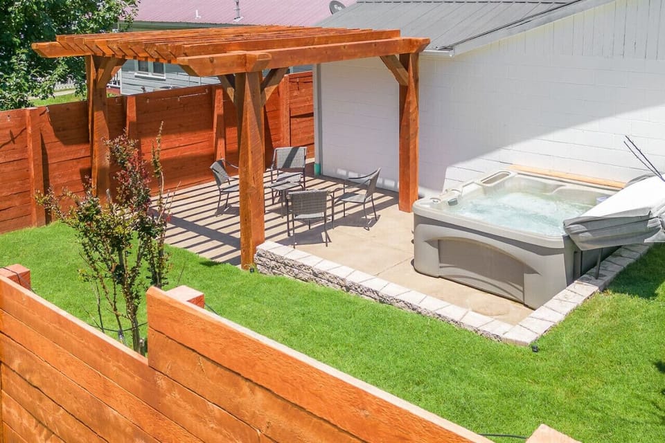 Relaxing Outdoor area with pergola, seating and hot tub