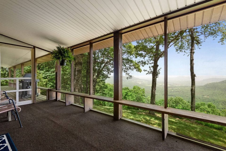 Screened in porch along the backside of the house. Amazing views!