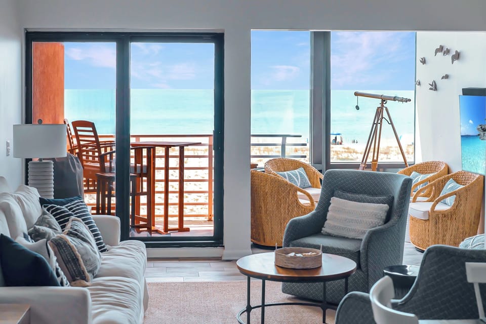 Relax in the spacious living room/dining room/solarium with incredible Gulf views. Light, bright and spacious with unobstructed views of the dunes and Gulf!