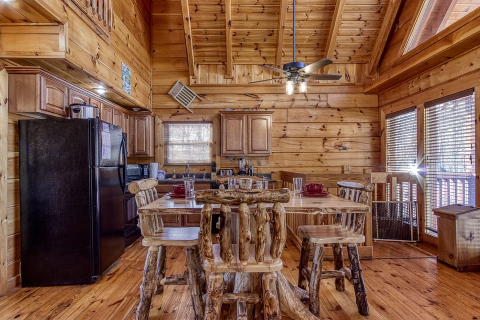 The dining table is conveniently located near the kitchen on the main level.
