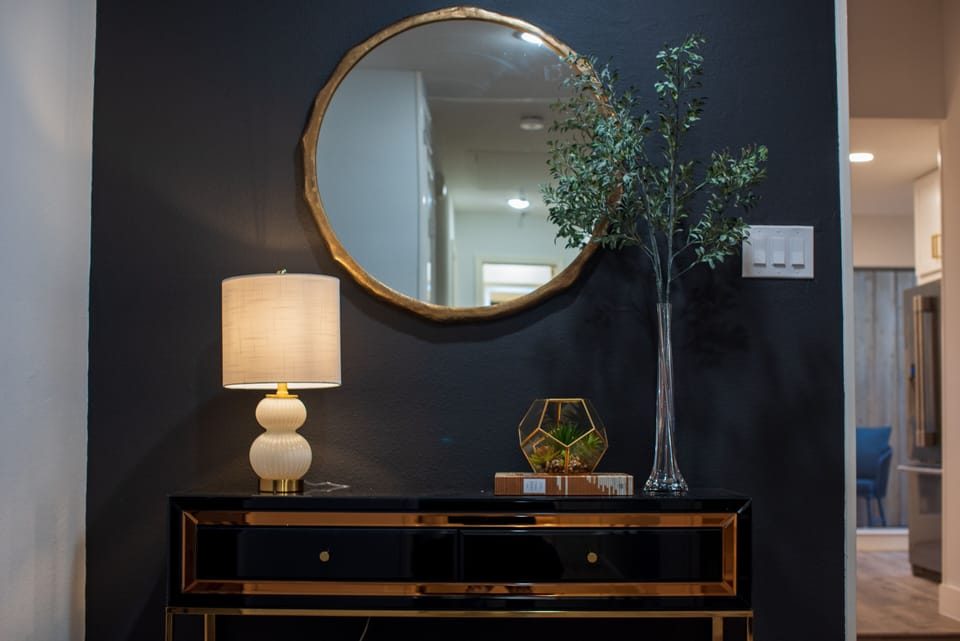 Our black accent wall accentuating the decor on the entry table!