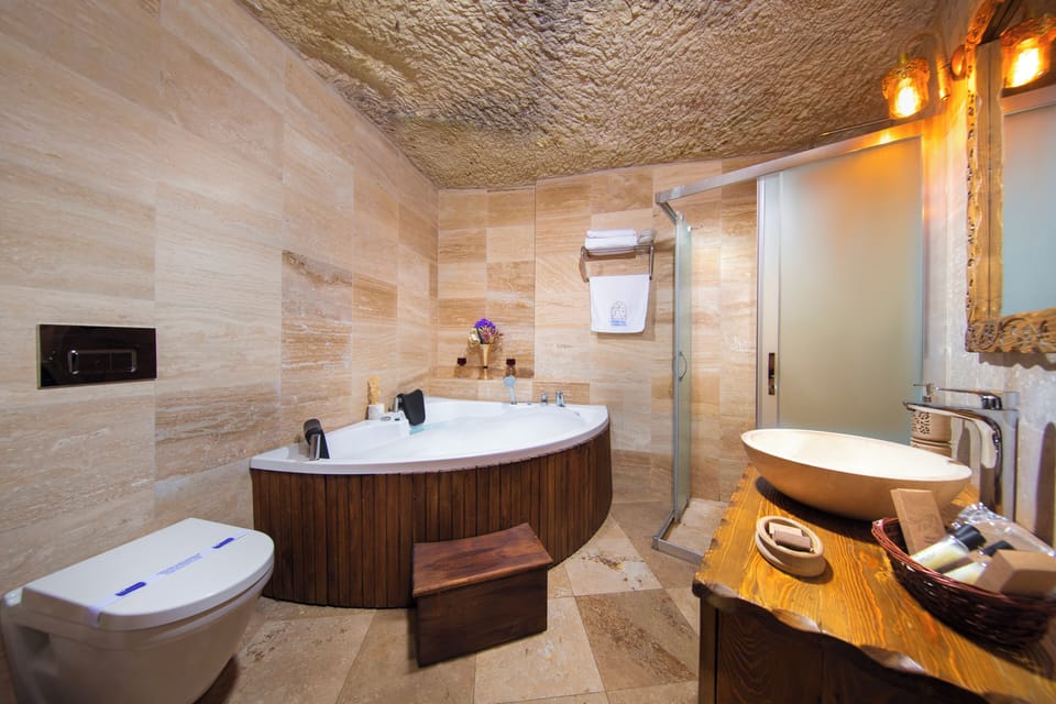 Deluxe Cave Room 202 | Bathroom | Hair dryer, bathrobes, slippers, towels