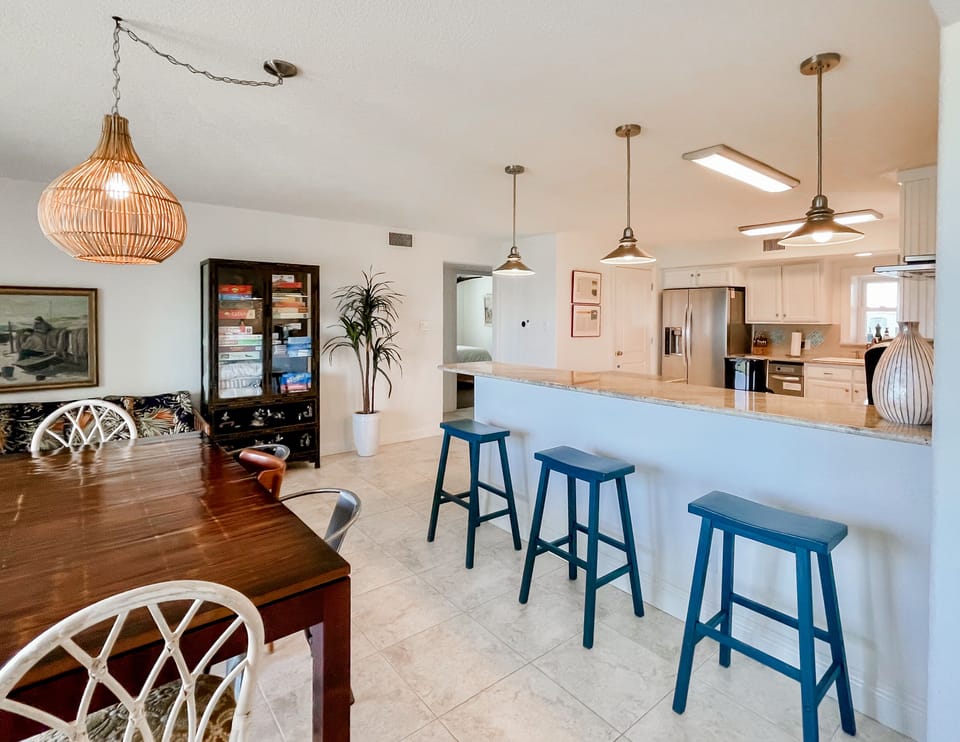 Dining room with ocean views. The condo is stocked with board games and puzzles.