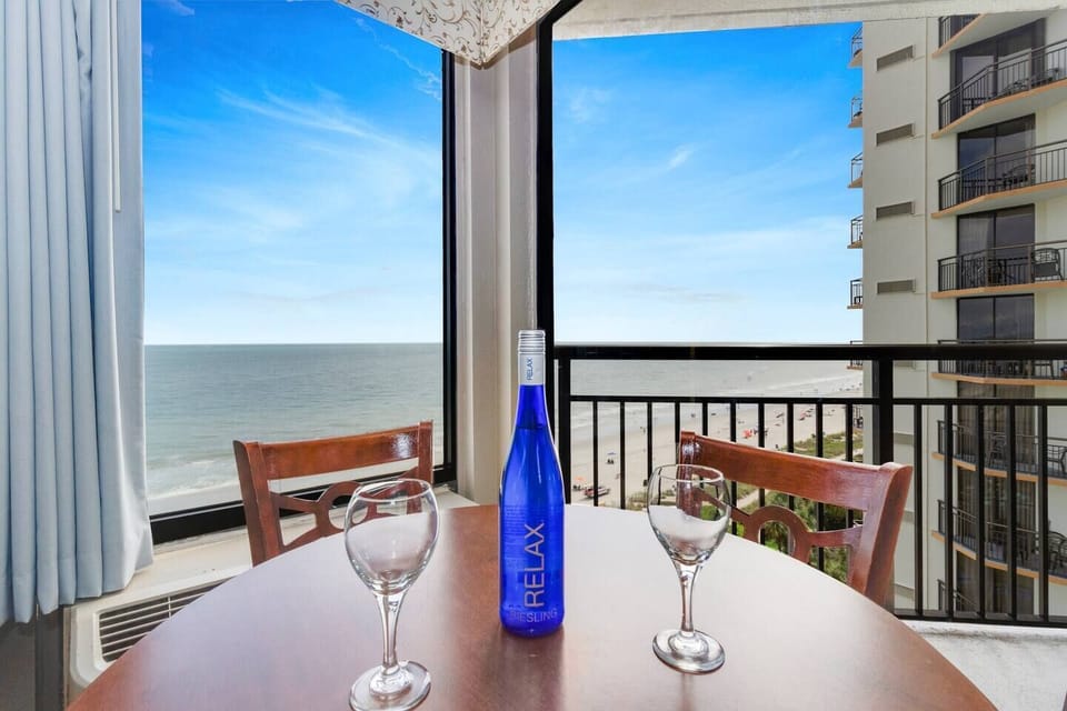 Dine with a view in our suite's dining area, where large windows showcase a stunning view, creating a picturesque backdrop for your meal.