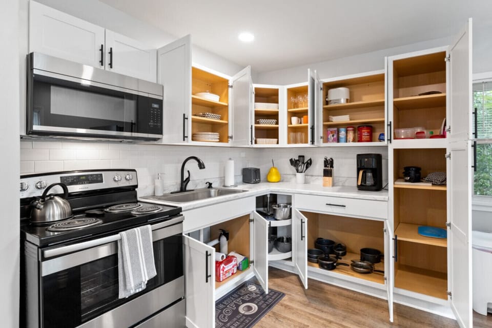 Fully equipped kitchen for cooking, baking and meal preparation.