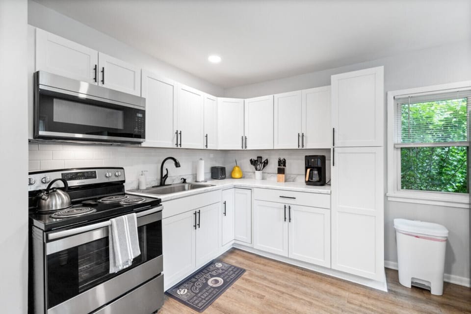 Fully equipped kitchen for cooking, baking and meal preparation.
