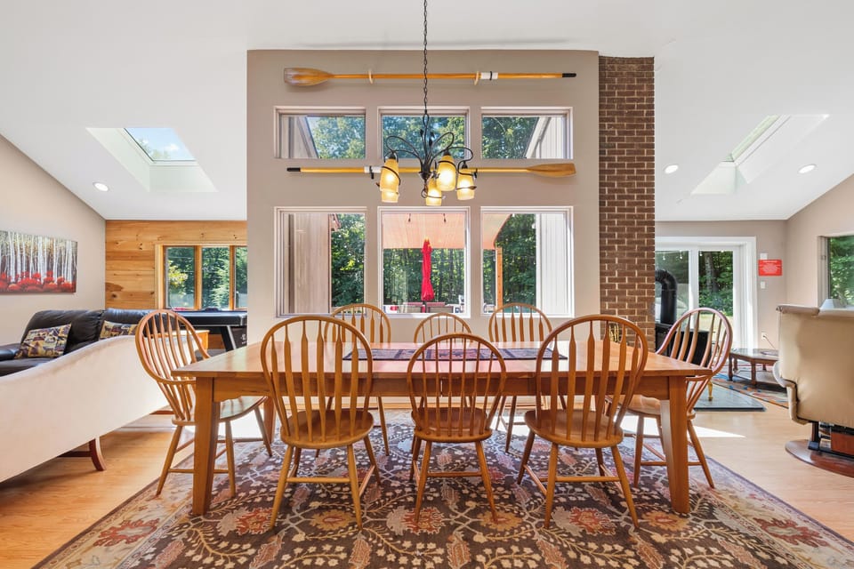 Dining Room with cherry table, seating for 8 people.  View of back yard & deck.