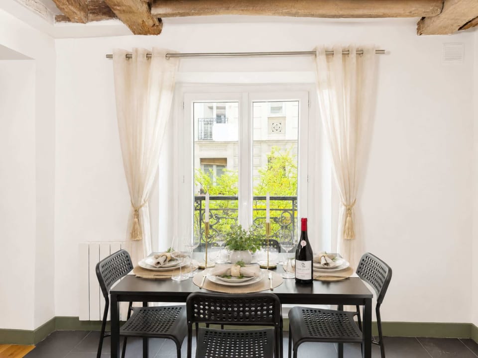 Dining table comfortably seats four and can be used as a work station.
