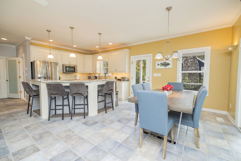 Main level. Open plan kitchen with 6-person dining set.