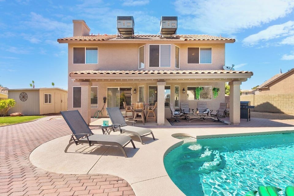 You've found Paradise in Peoria! Relax in the backyard with your friends and family. Splash in the pool and lounge on the patio furniture! Enjoy a nice BBQ dinner as you watch the sunset from a floaty in the pool! 