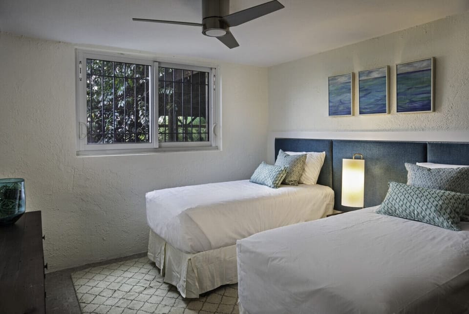 Bedroom 4, lower level, with 2 twin beds, and cold AC