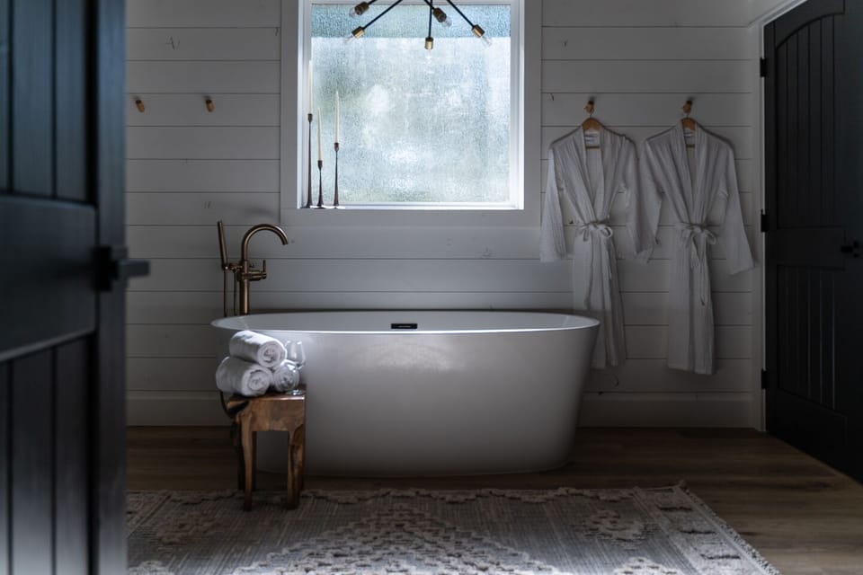 A large frosted window allows natural light to fill the space while providing you complete privacy while you soak in the tub after a long day of adventuring.