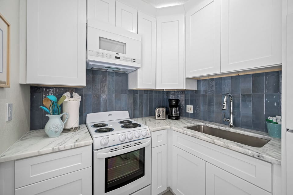 Sleek design with high-end appliances, ample counter space, and everything you need for home-cooked meals