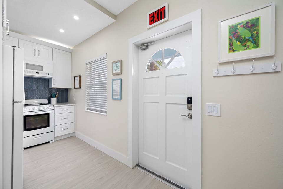 A welcoming entrance with stylish décor, leading into the modern kitchen and living space.