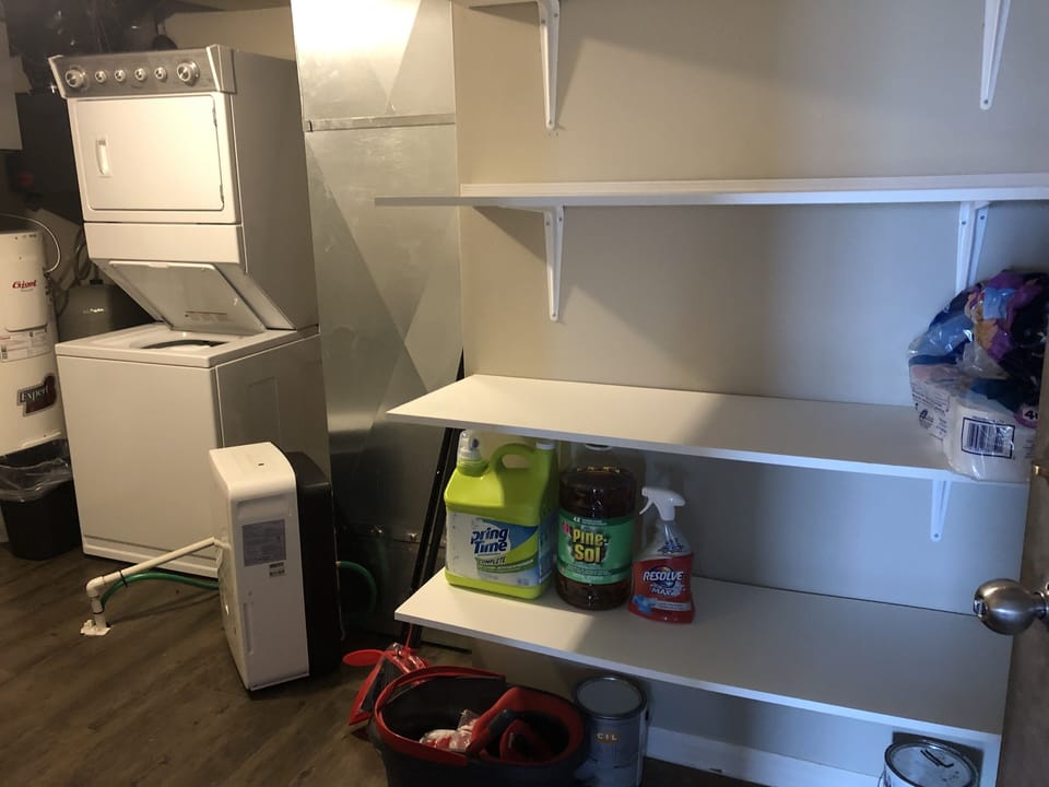 Laundry room stocked with detergent (shared with adjacent apartment)