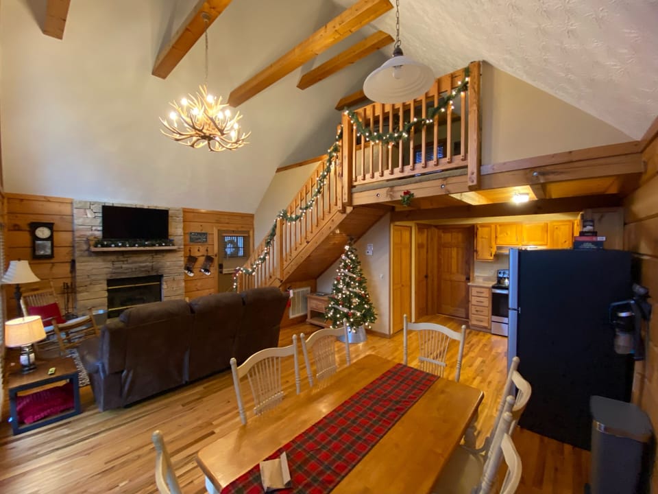 Christmas decorations, view of living dining room, kitchen and upstairs bedroom