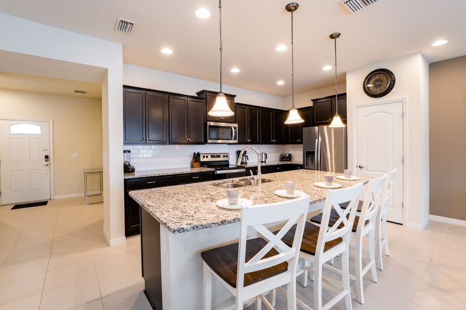 Kitchen showing breakfast bar