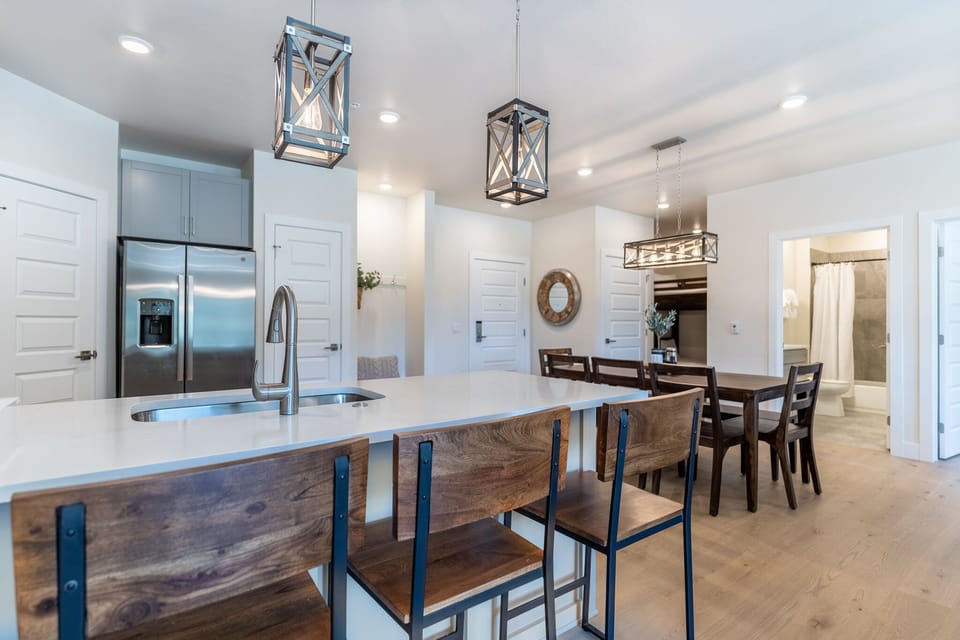 Gather around your spacious kitchen island for morning coffee or casual meals, with modern appliances and stylish pendant lighting.