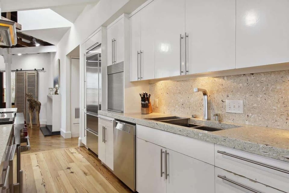 Oyster shell Quartz counters & top-of-the-line appliances in this spacious, sunny kitchen!