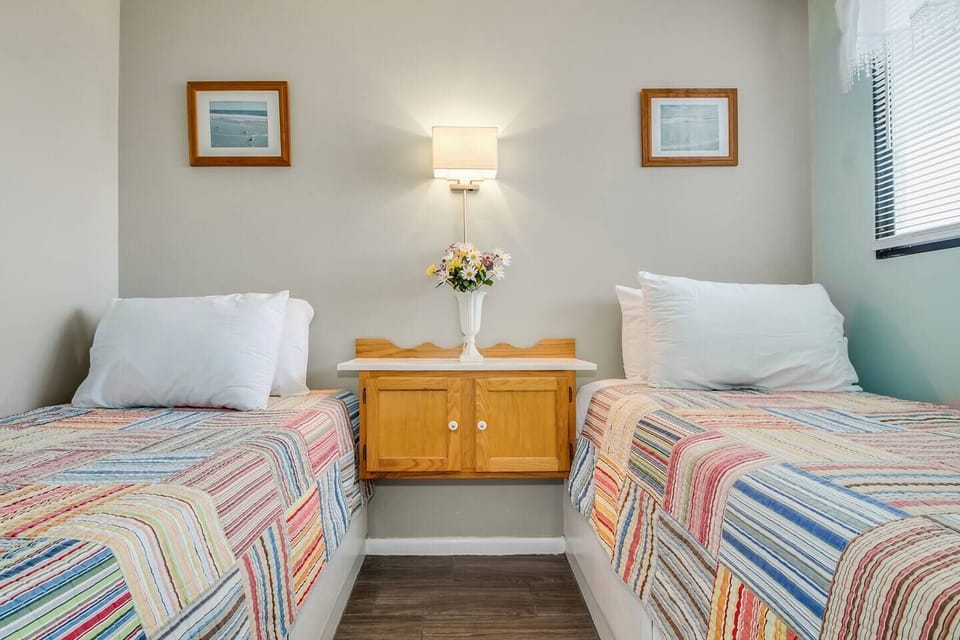 Indulge in a regal night's sleep in the master bedroom featuring a king-size bed. The second bedroom offers another king-size haven, while the third bedroom is perfect for accommodating friends or family with two twin-size beds.
