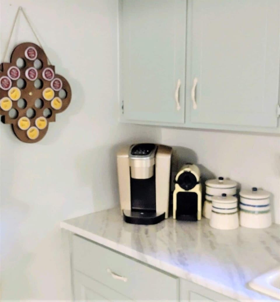 Coffee Station with Keurig and Nespresso coffeemakers and a complimentary assortment of various roasts, sweeteners and creamers for your enjoyment