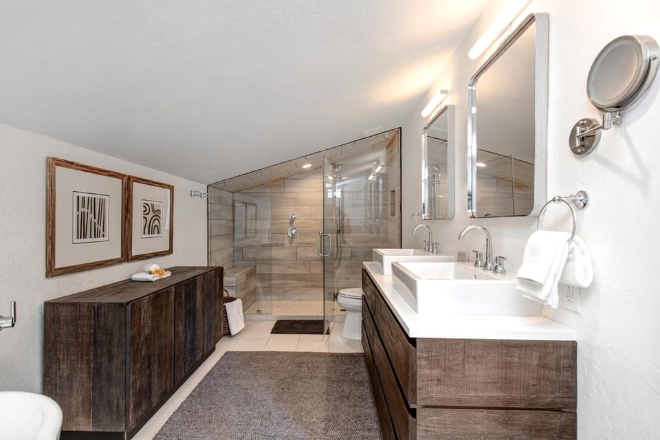 Dual vanity, granite counters, and walk-in glass shower make your primary bath feel spa-worthy.