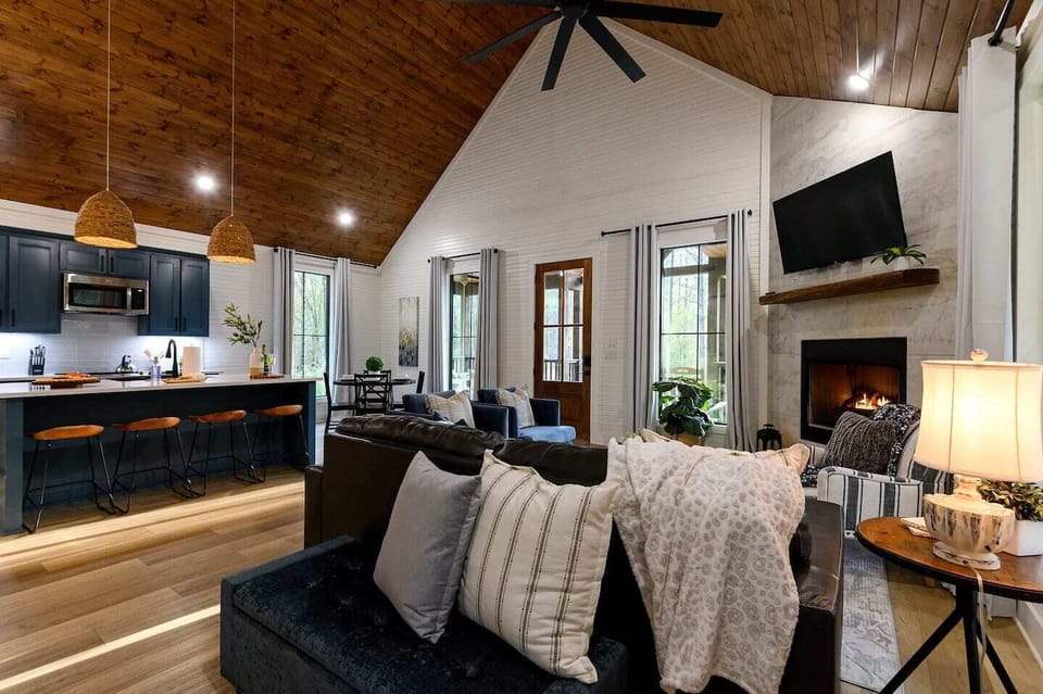 Step inside to warm wood tones, natural light, and the kind of cabin that looks exactly like the photos.