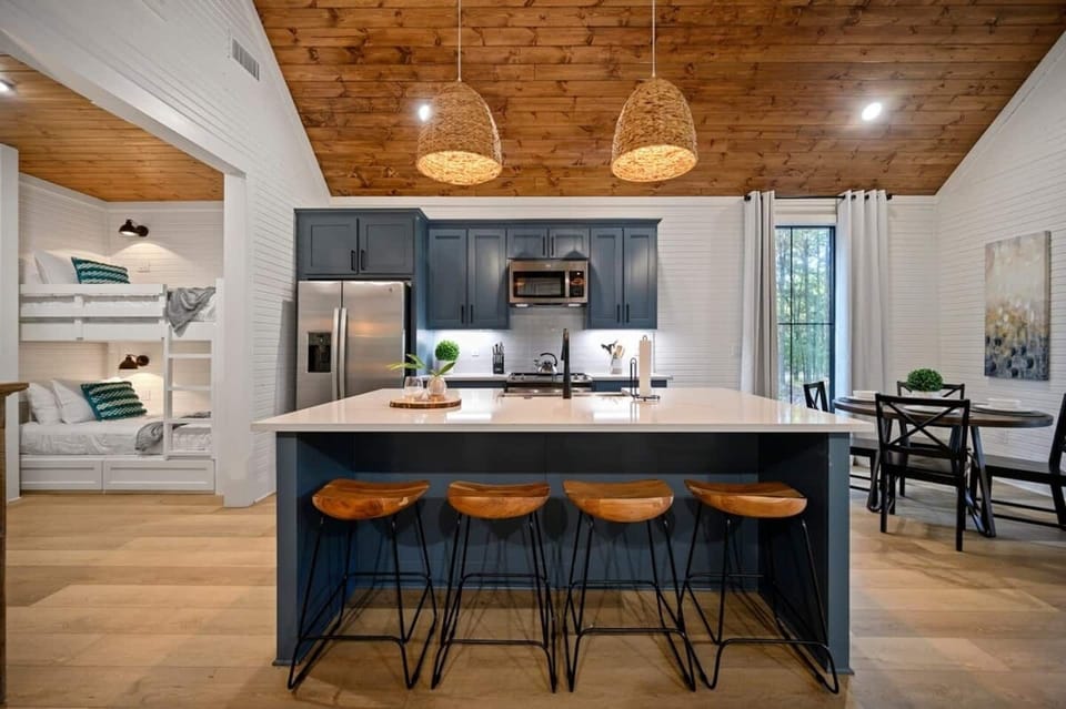 Cook every meal if you want to — GE stainless appliances, full counter space, everything fully stocked.
