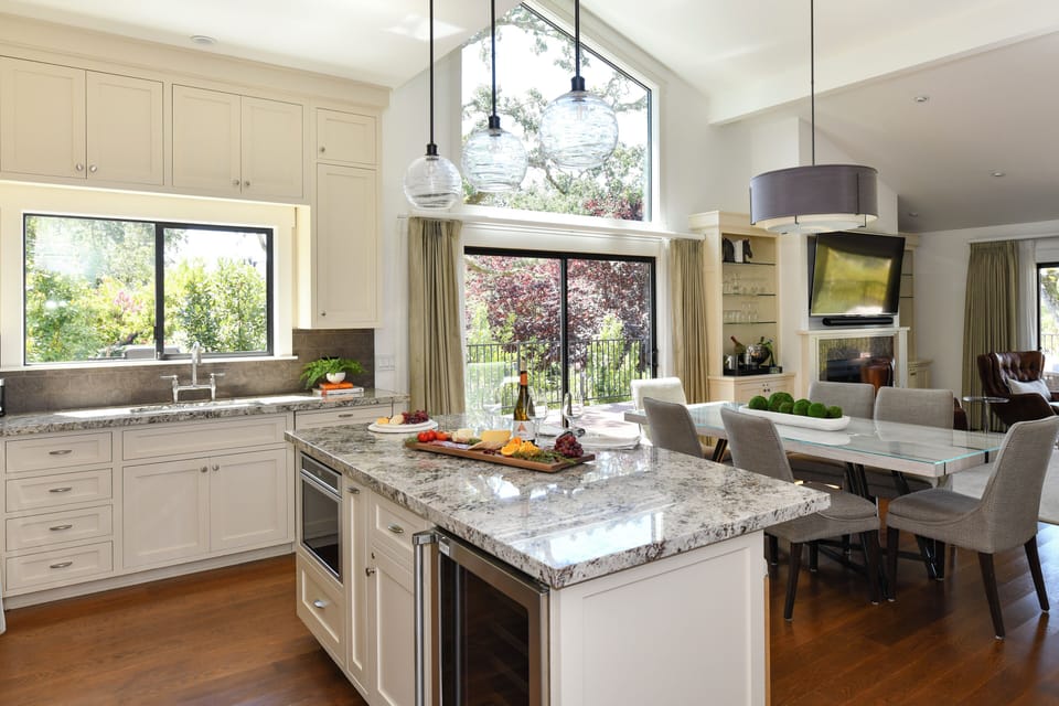 Kitchen with Thermador wine refrigerator and under counter microwave.