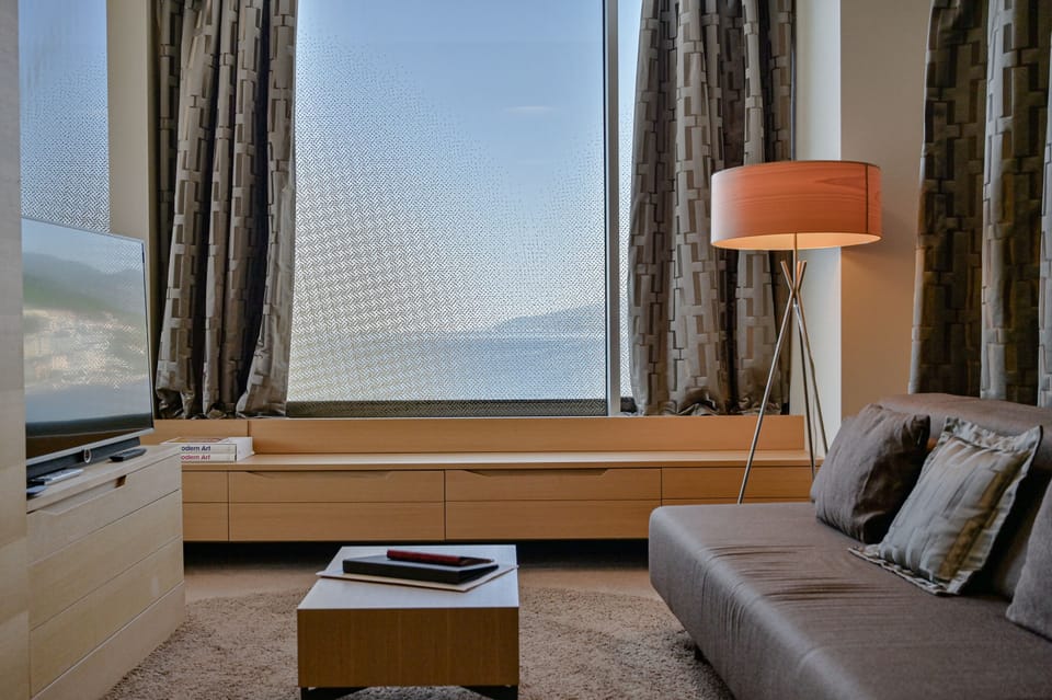 Deluxe Suite, Jetted Tub, Sea View | Living area | 48-inch flat-screen TV with cable channels, TV