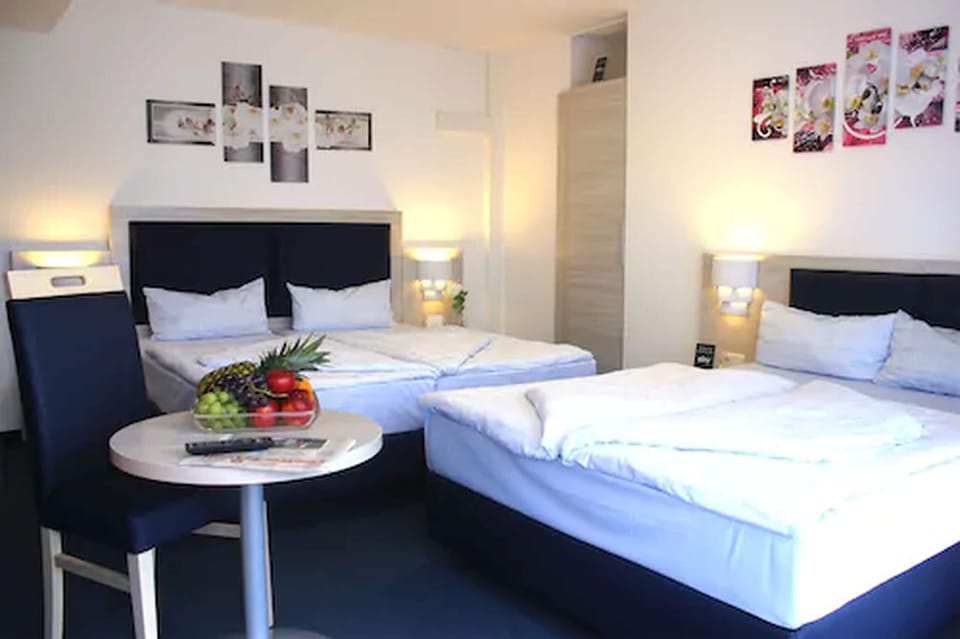 Family Room | Down comforters, individually furnished, desk, iron/ironing board