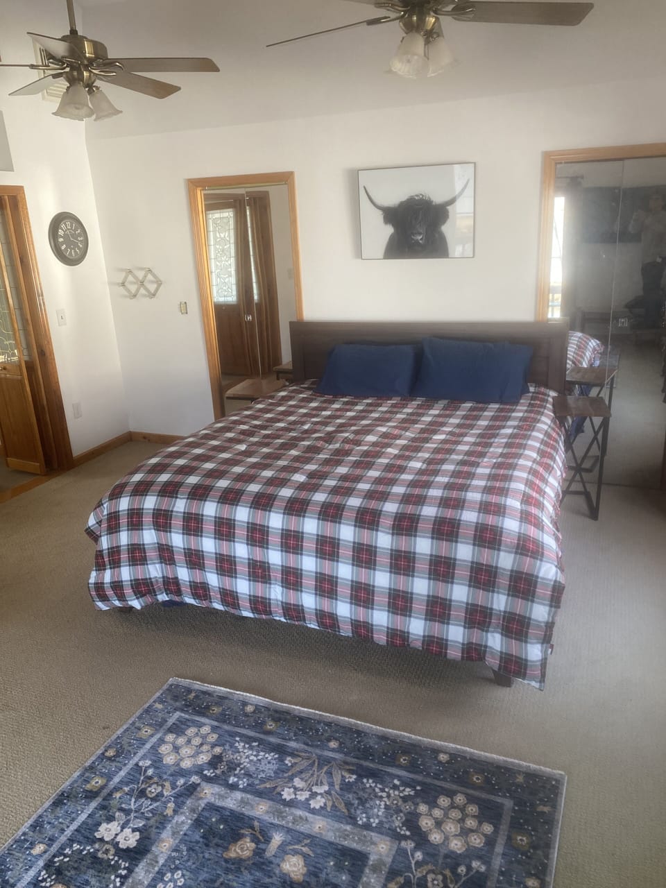 Spacious Main bedroom w/ sliding glass door opening to private deck facing lake