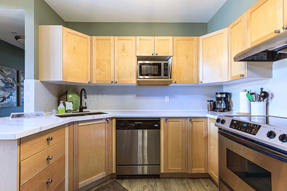 All the kitchen essentials provided, with abundant cabinetry for easy organization.