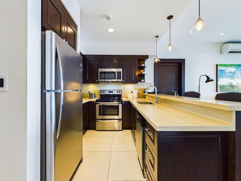 Open kitchen, stainless steel appliances