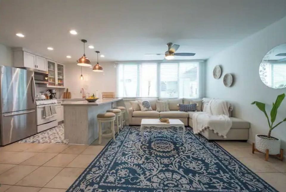 Living room, island seating and kitchen 