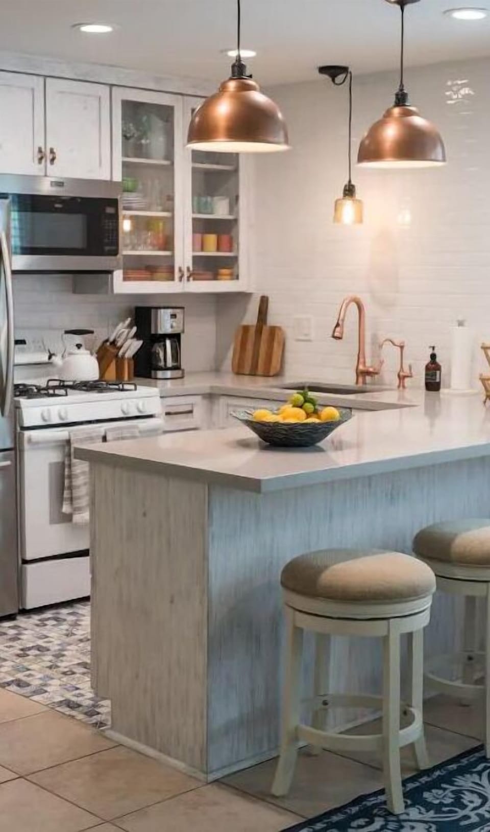 Large kitchen island with comfy stools.