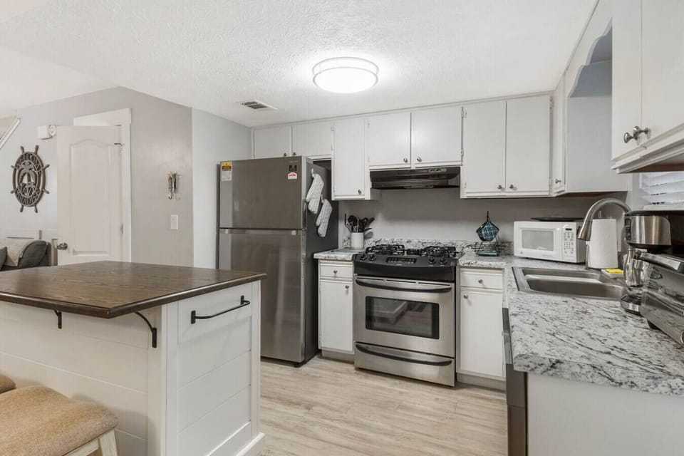 First Floor Full Size Kitchen with Island Bar Seating
