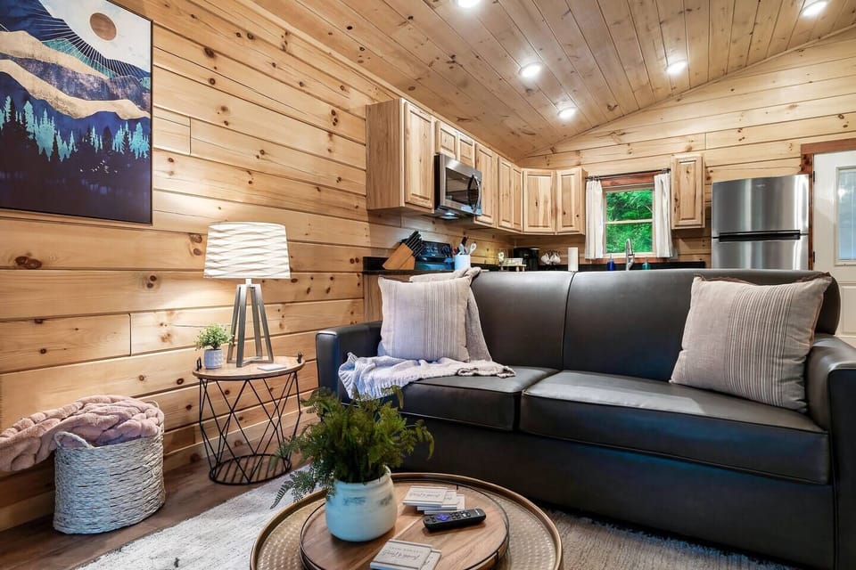 Living room with cozy area to sit by the fire and watch a movie or read a book. 