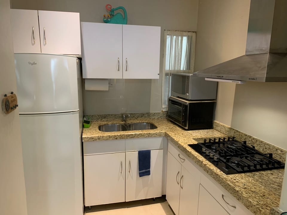 Large microwave and toaster oven available. Four burner gas stove with exhaust.