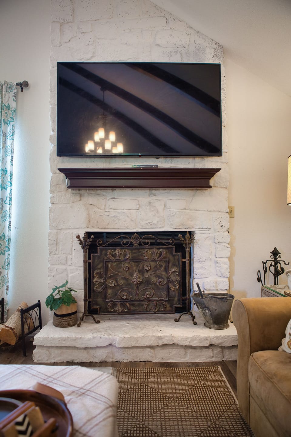 70 inch television about the woodburning fireplace