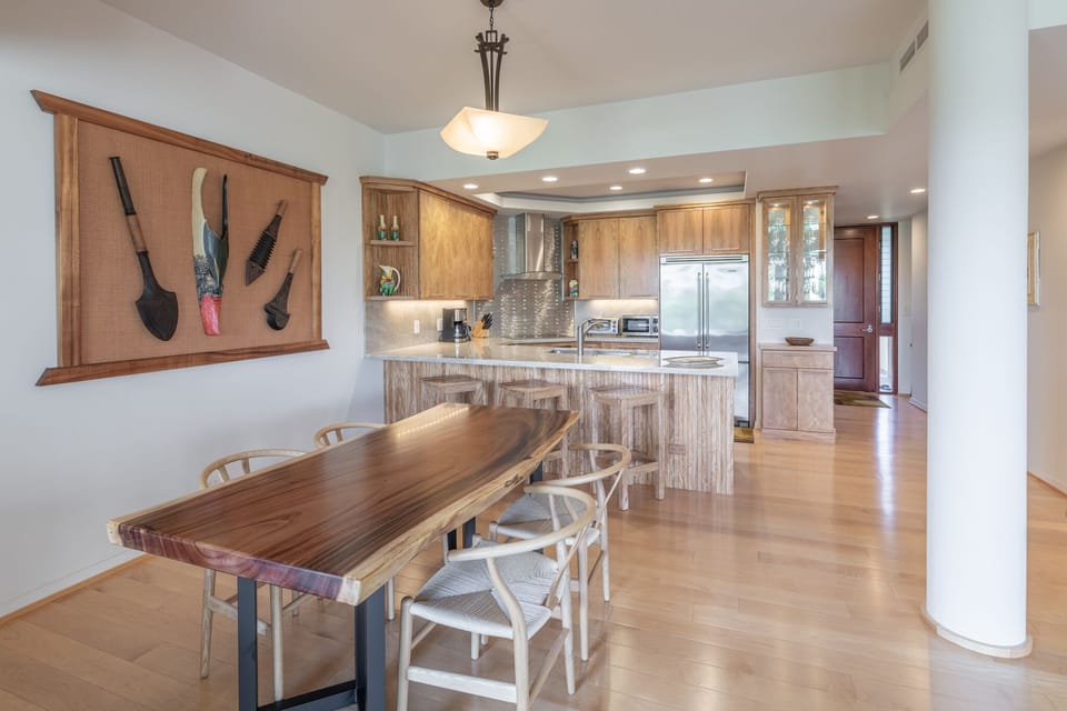 Beautiful natural edge Monkey Pod dining room table.