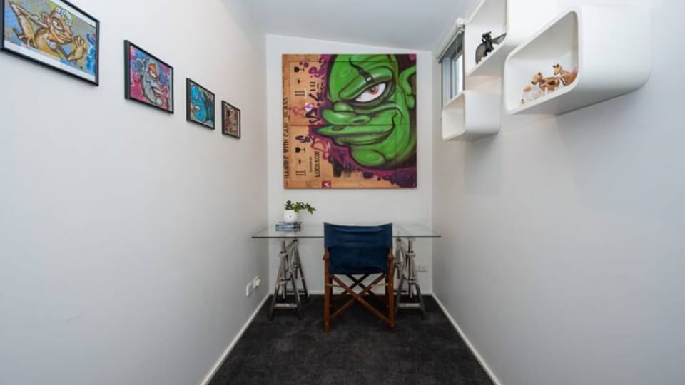 Dedicated desk with chair and local art work