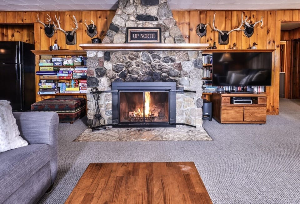 enjoy the warmth of the fire in the wood burning fireplace