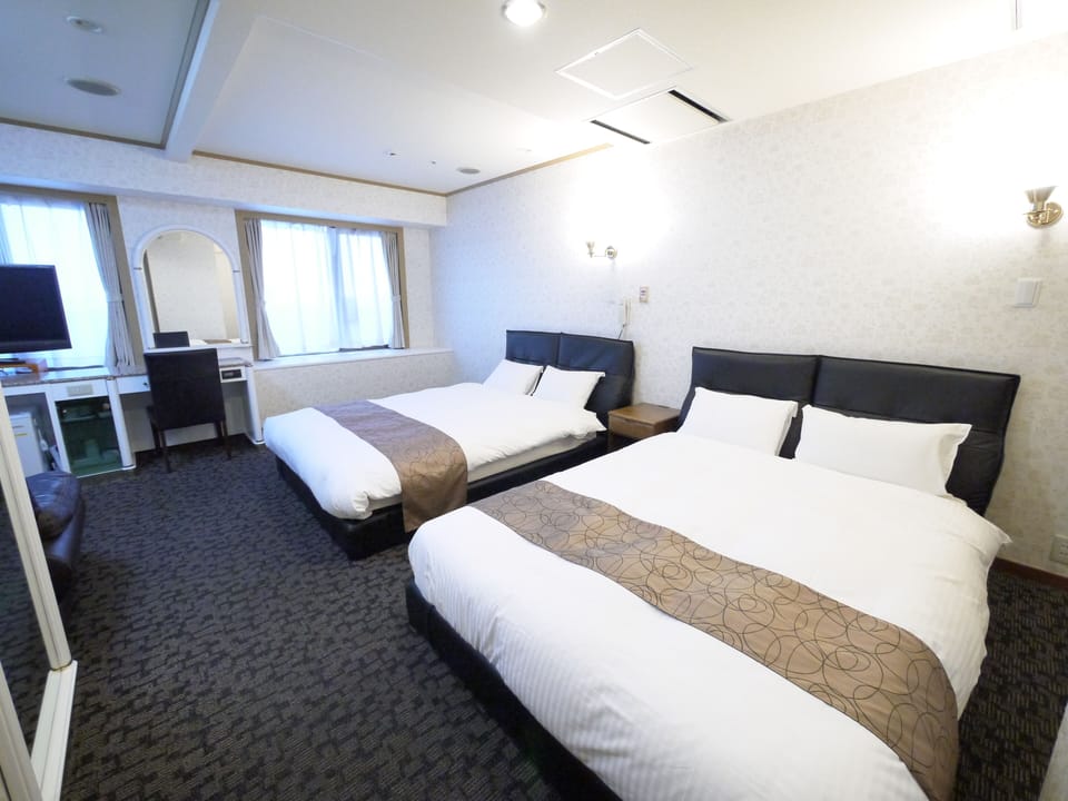 Deluxe Room, Non Smoking | Desk, iron/ironing board, free WiFi, bed sheets