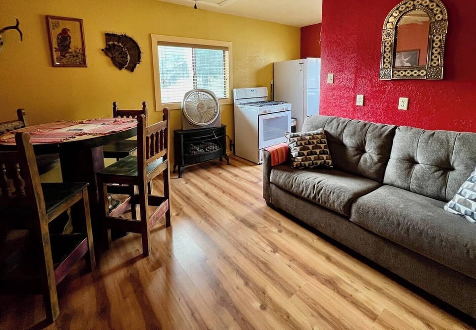 Pull out full-size sofa bed and dining table share a room